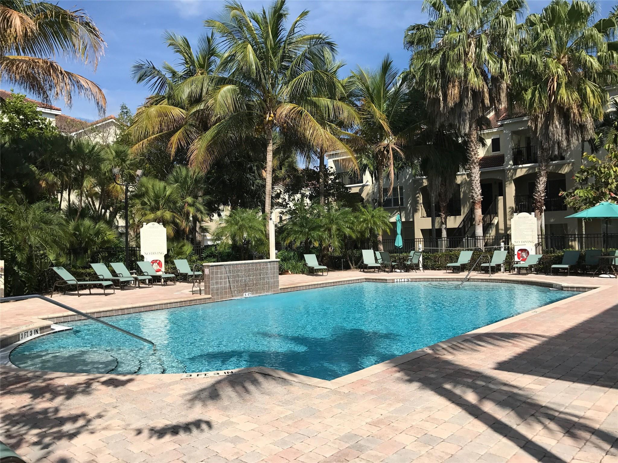 5800 West Sample Road, Unit 305 Coral Springs, FL 33067 - Photo 16 of 28 a view of a backyard