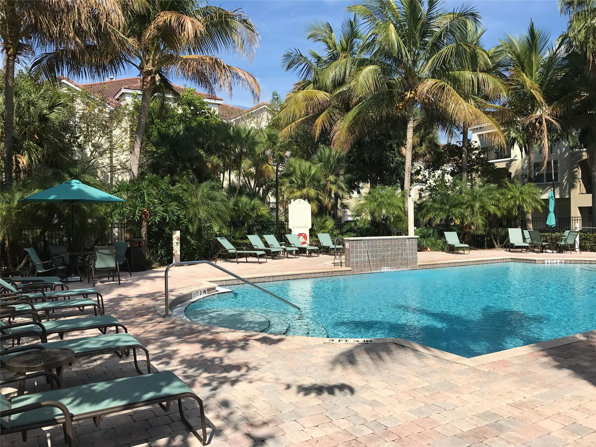 5800 West Sample Road, Unit 305 Coral Springs, FL 33067 - Photo 18 of 28 a view of a park with plants and trees