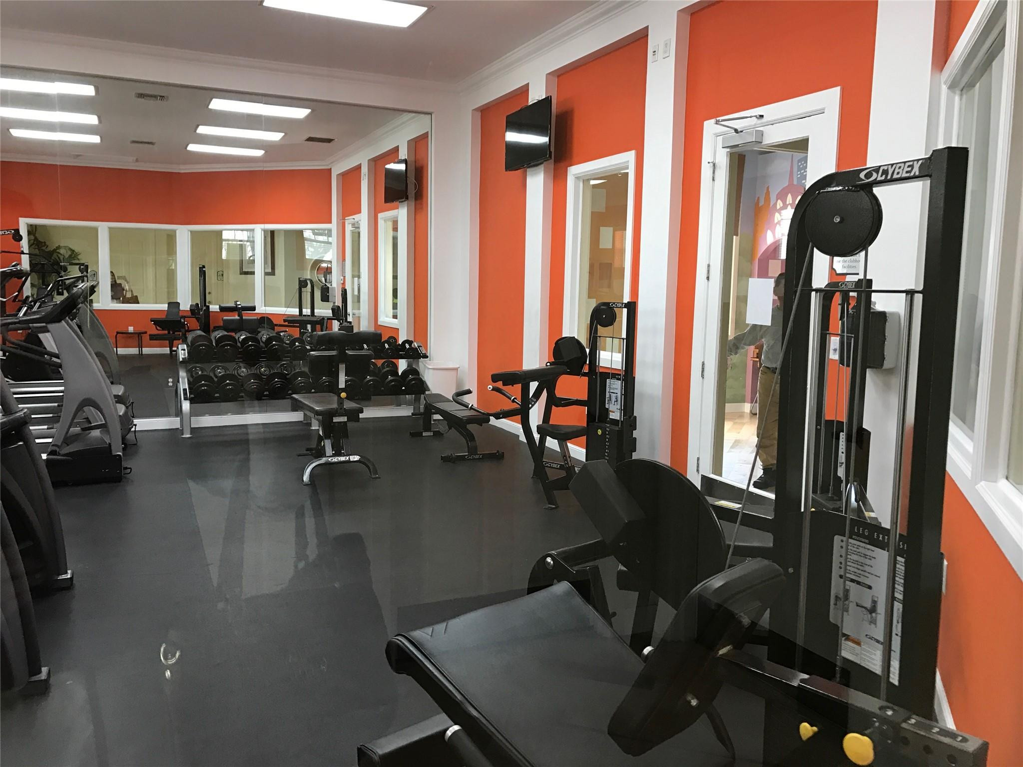 5800 West Sample Road, Unit 305 Coral Springs, FL 33067 - Photo 22 of 28 a gym hall with exercise machine