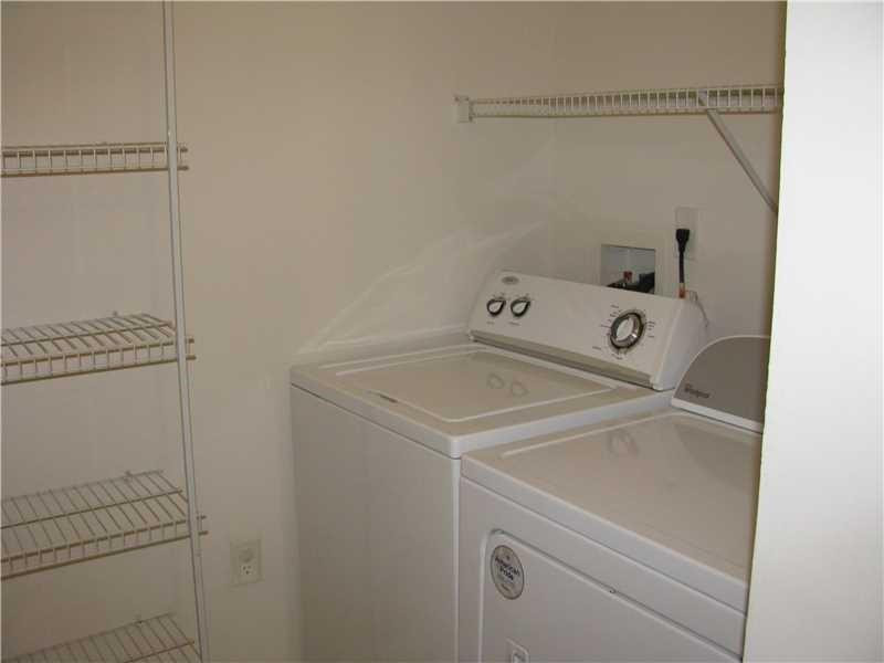5800 West Sample Road, Unit 305 Coral Springs, FL 33067 - Photo 6 of 28 a utility room with dryer and washer