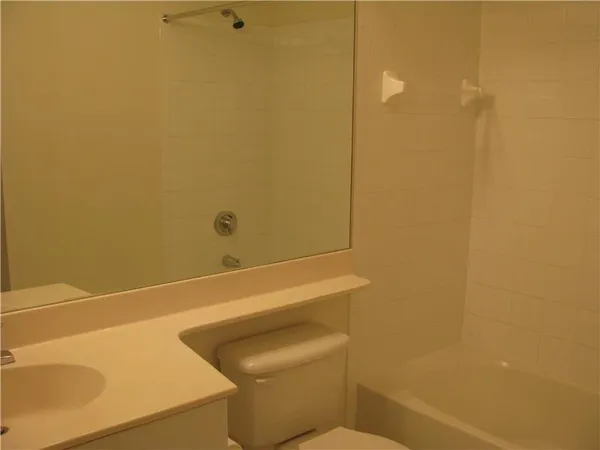 a bathroom with a toilet and a sink