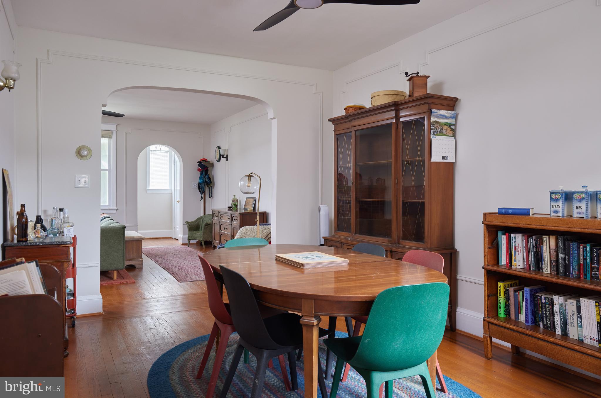 5417 4th Street Northwest Washington, DC 20011 - Photo 11 of 29 a view of a a dining room with furniture and a book shelf