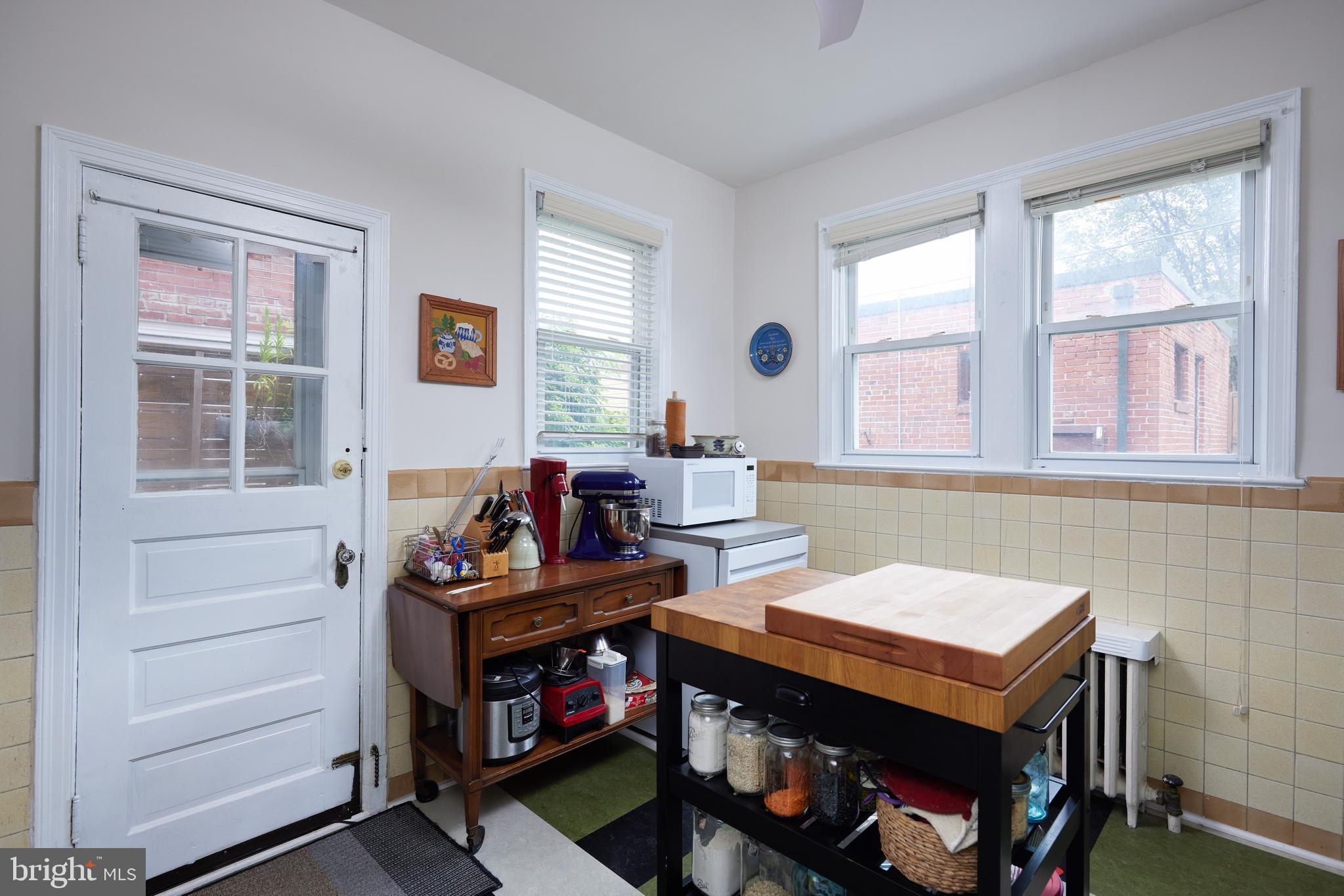 5417 4th Street Northwest Washington, DC 20011 - Photo 15 of 29 a view of a workspace with furniture and a window