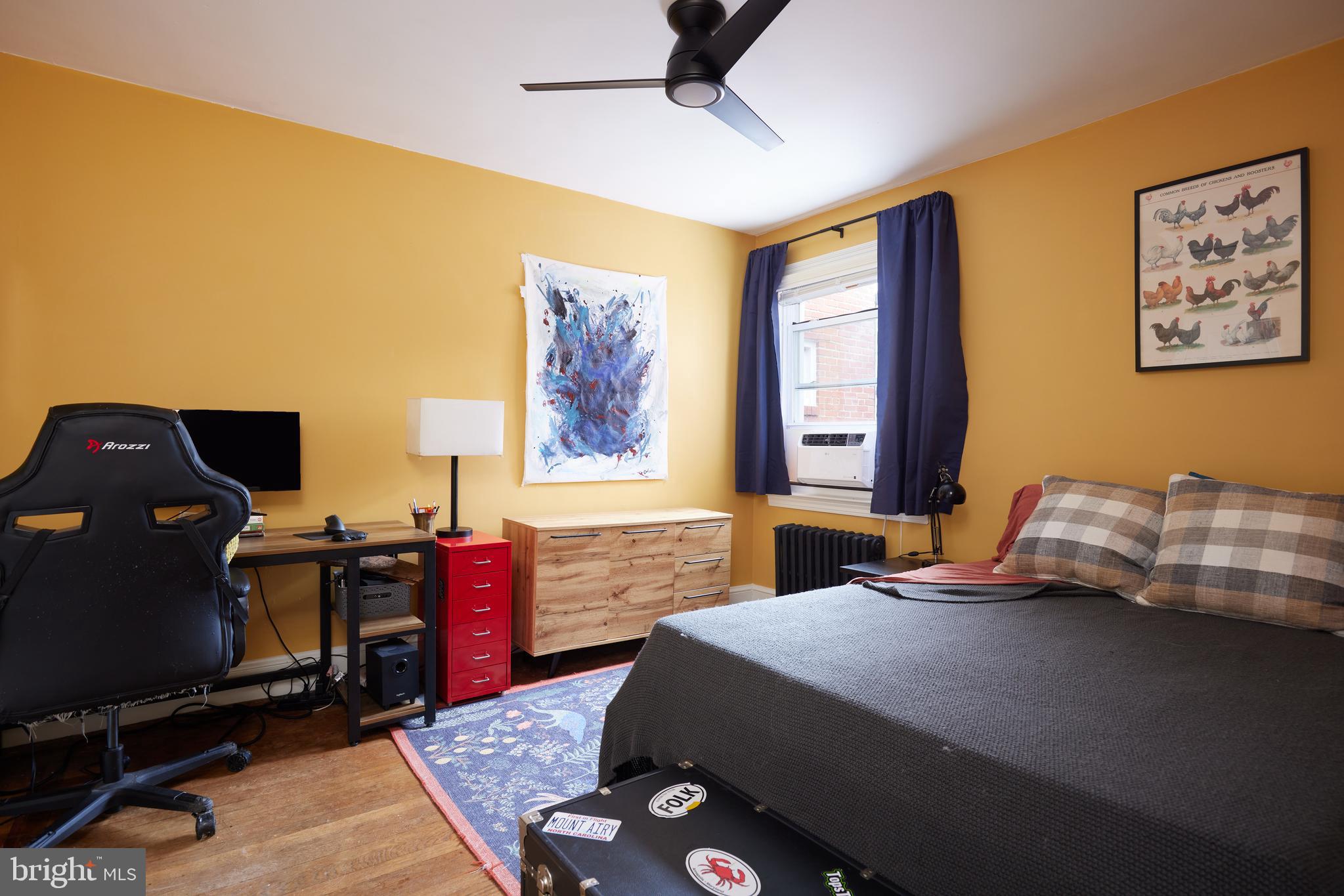 5417 4th Street Northwest Washington, DC 20011 - Photo 20 of 29 a bedroom with a bed and wooden floor