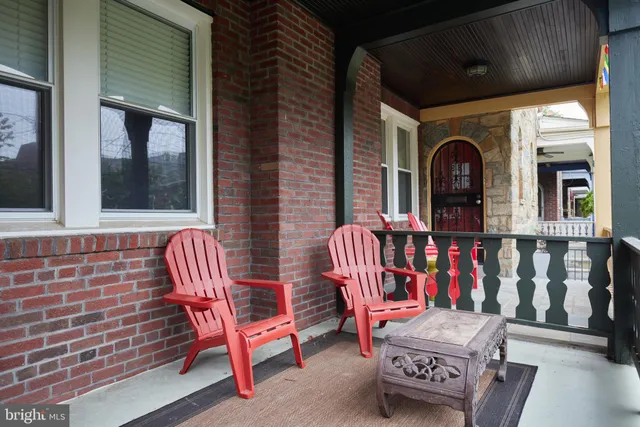 a view of a chairs and table in back of the house