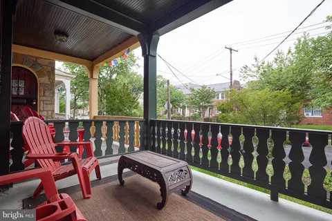 a view of a two chairs in the balcony