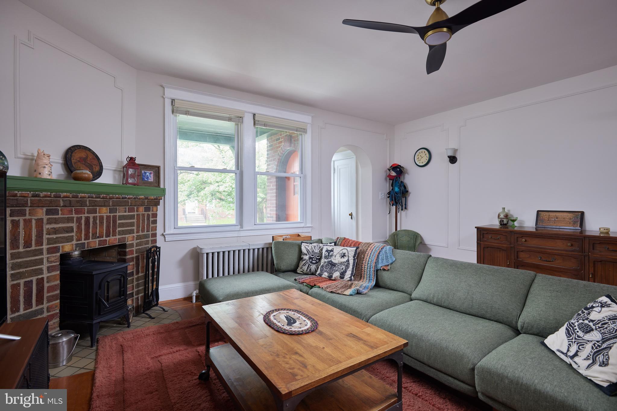 5417 4th Street Northwest Washington, DC 20011 - Photo 6 of 29 a living room with furniture a fireplace and a window
