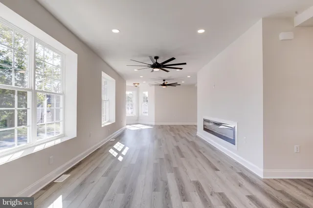 a kitchen with granite countertop a sink stainless steel appliances and cabinets