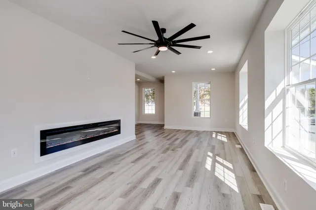 a bathroom with a granite countertop sink a mirror and a vanity