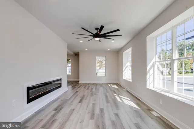 a kitchen with a stove top oven and refrigerator