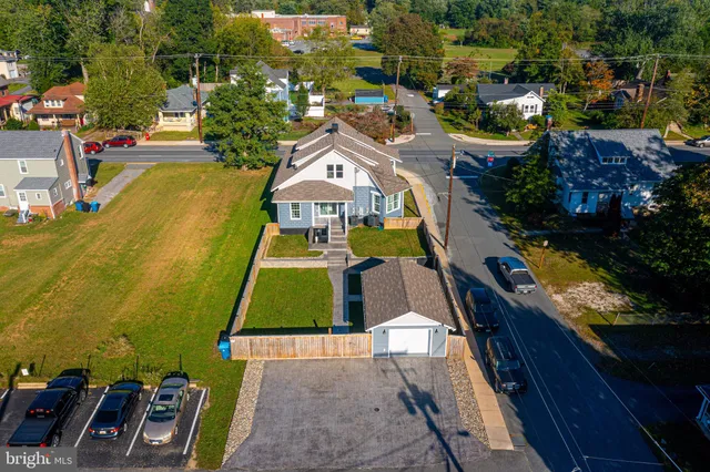 an aerial view of a house with a garden