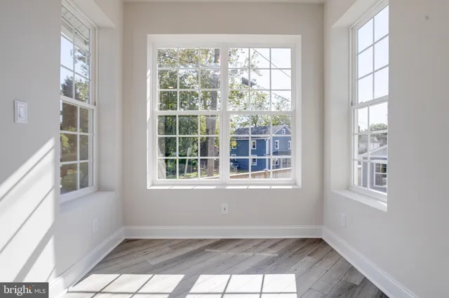 a kitchen with granite countertop white cabinets and a sink