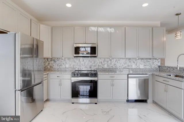 a view of an empty room and a window
