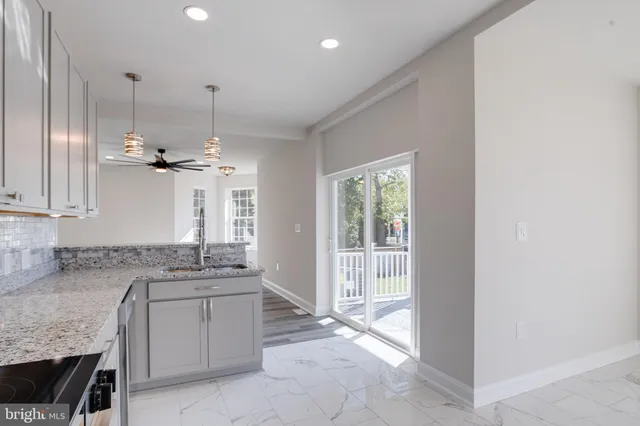 a view of an empty room and a window