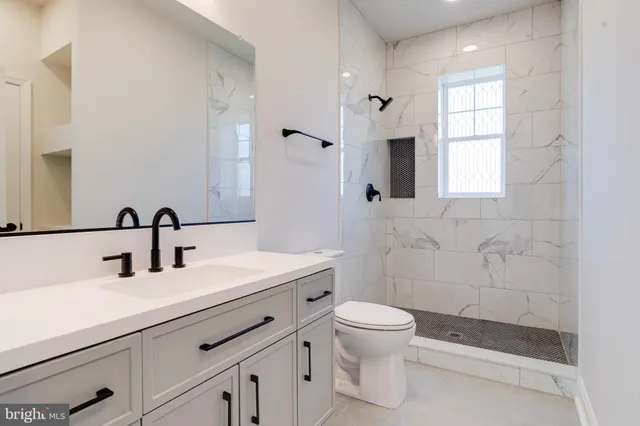 a view of an empty room with a ceiling fan