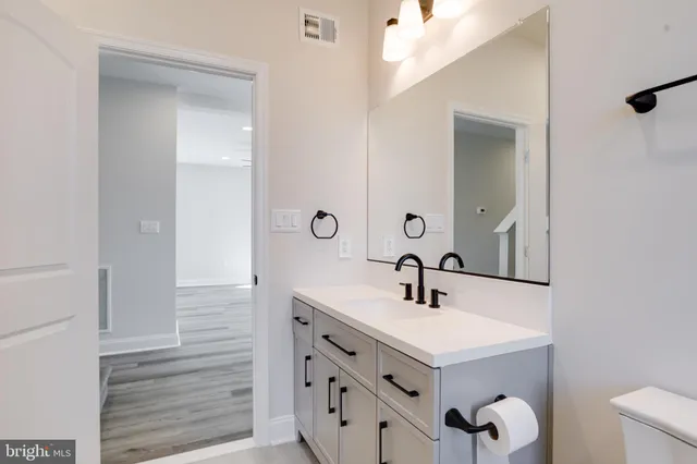 an empty room with a empty space and windows