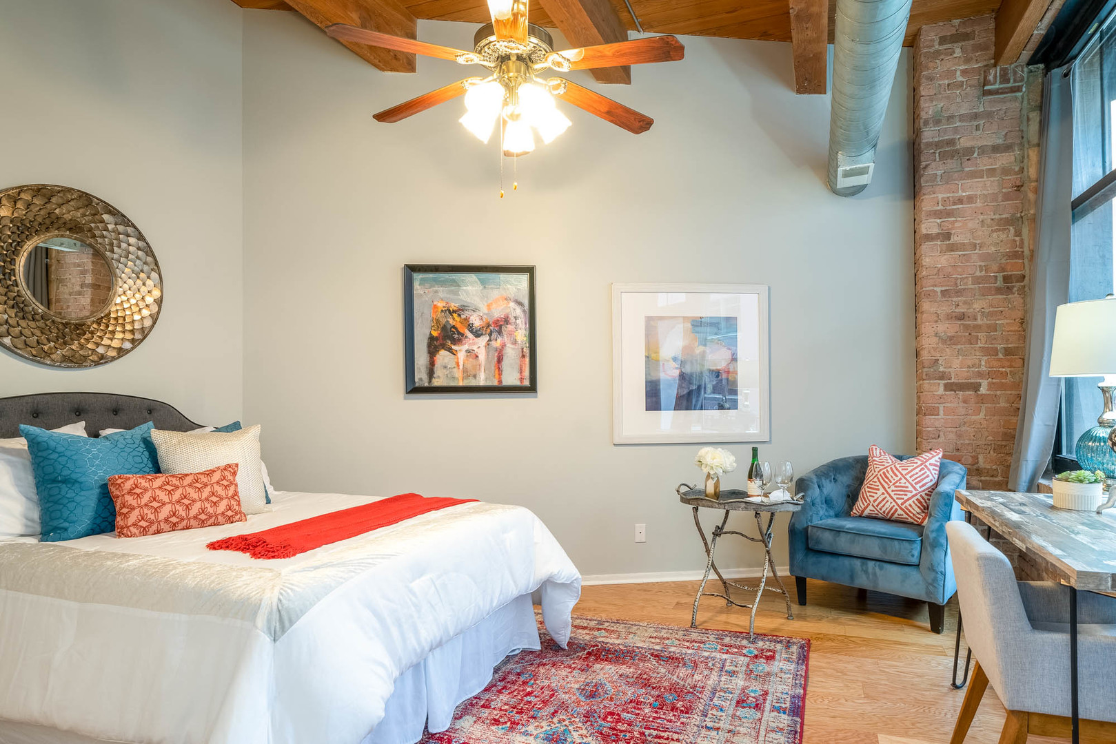 625 West Jackson Boulevard, Unit 313 Chicago, IL 60661 - Photo 15 of 33 a bedroom with a bed and a chandelier