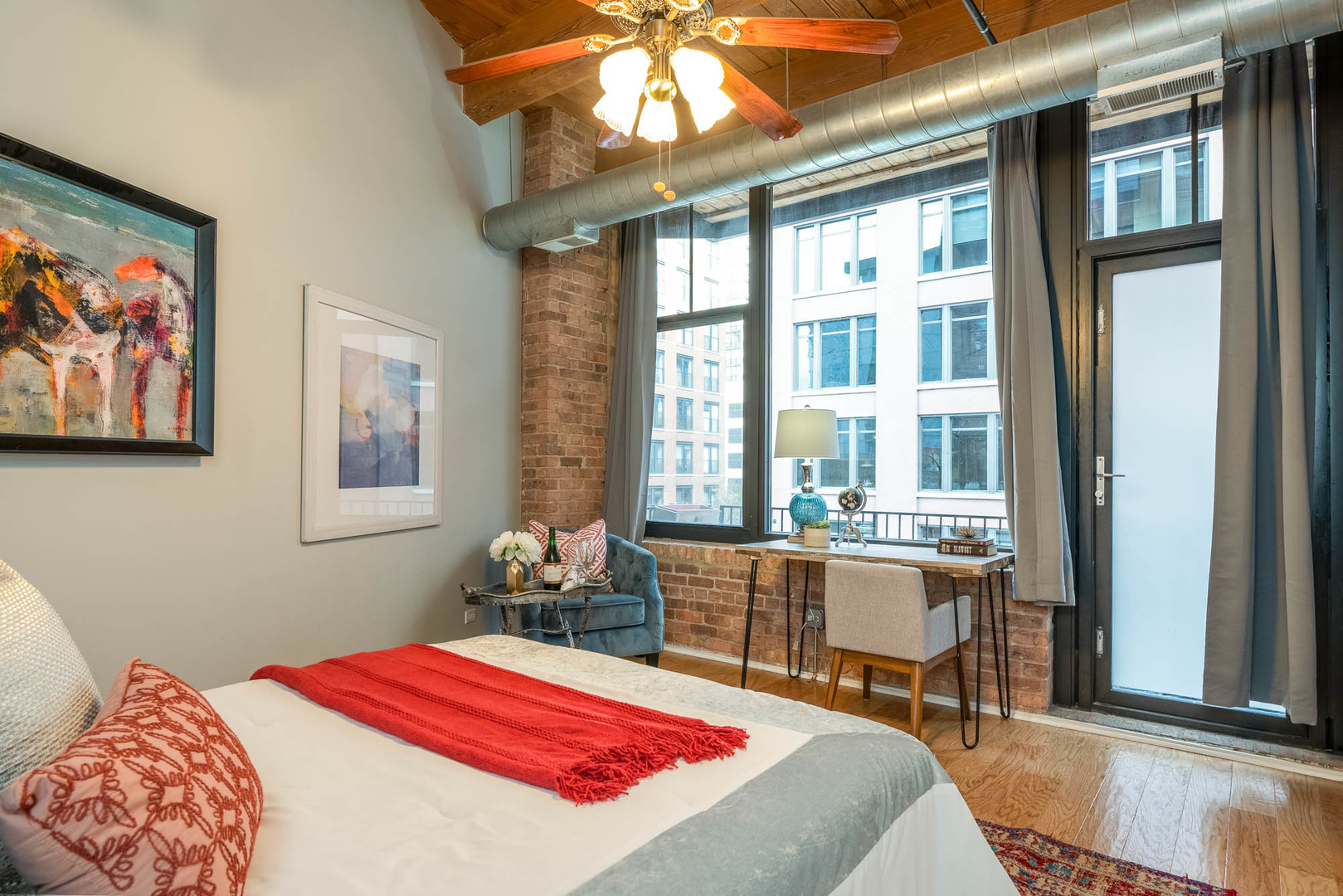 625 West Jackson Boulevard, Unit 313 Chicago, IL 60661 - Photo 16 of 33 a bedroom with a bed and a large window with outer view