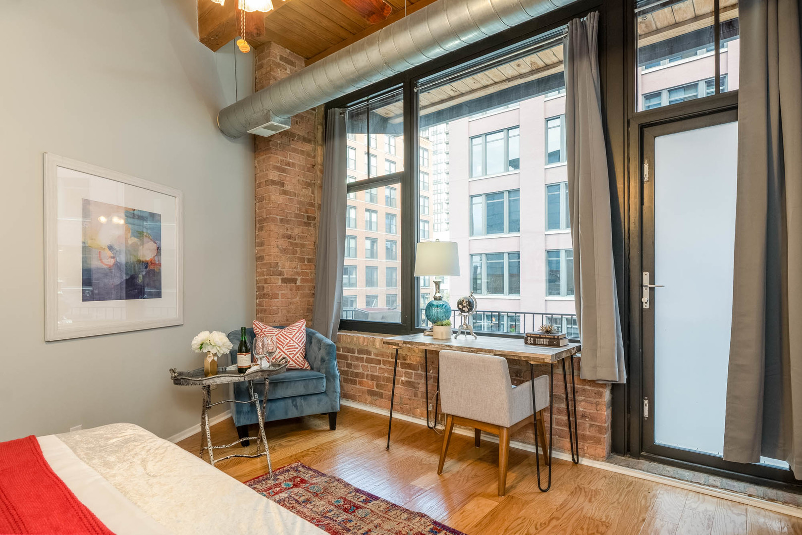 625 West Jackson Boulevard, Unit 313 Chicago, IL 60661 - Photo 17 of 33 a living room with furniture and a window