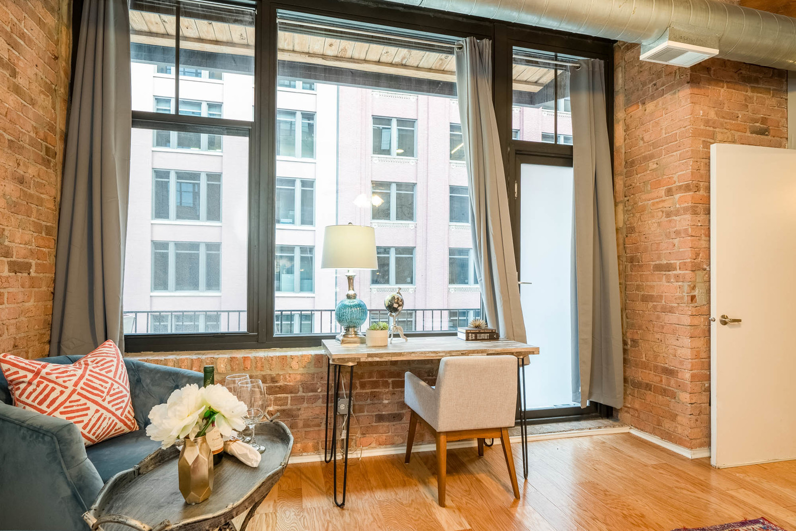 625 West Jackson Boulevard, Unit 313 Chicago, IL 60661 - Photo 18 of 33 a view of a dining room with furniture window and wooden floor