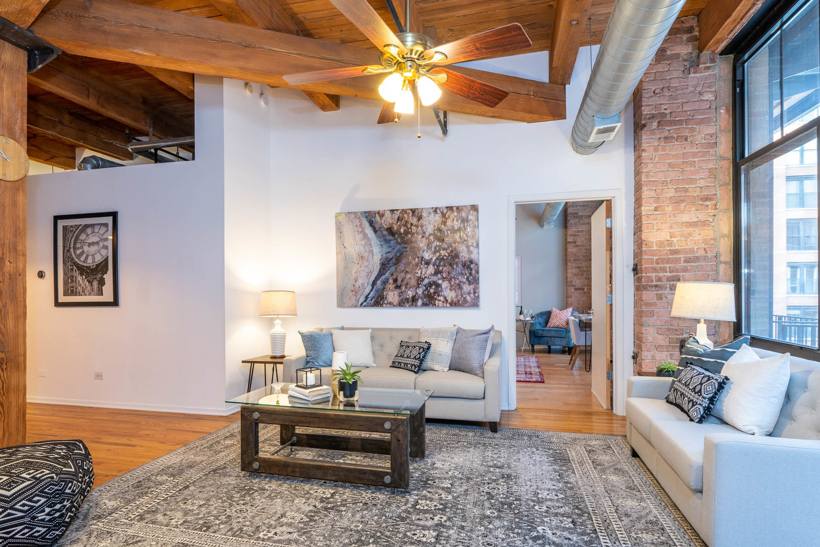625 West Jackson Boulevard, Unit 313 Chicago, IL 60661 - Photo 22 of 33 a living room with furniture and a rug