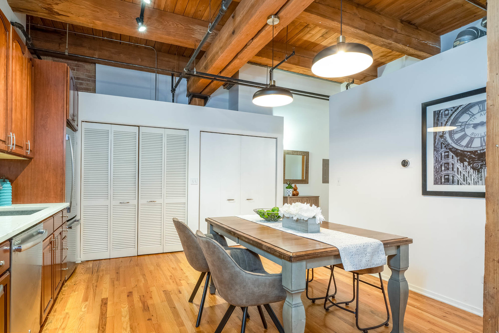 625 West Jackson Boulevard, Unit 313 Chicago, IL 60661 - Photo 25 of 33 a view of a dining room with furniture and wooden floor