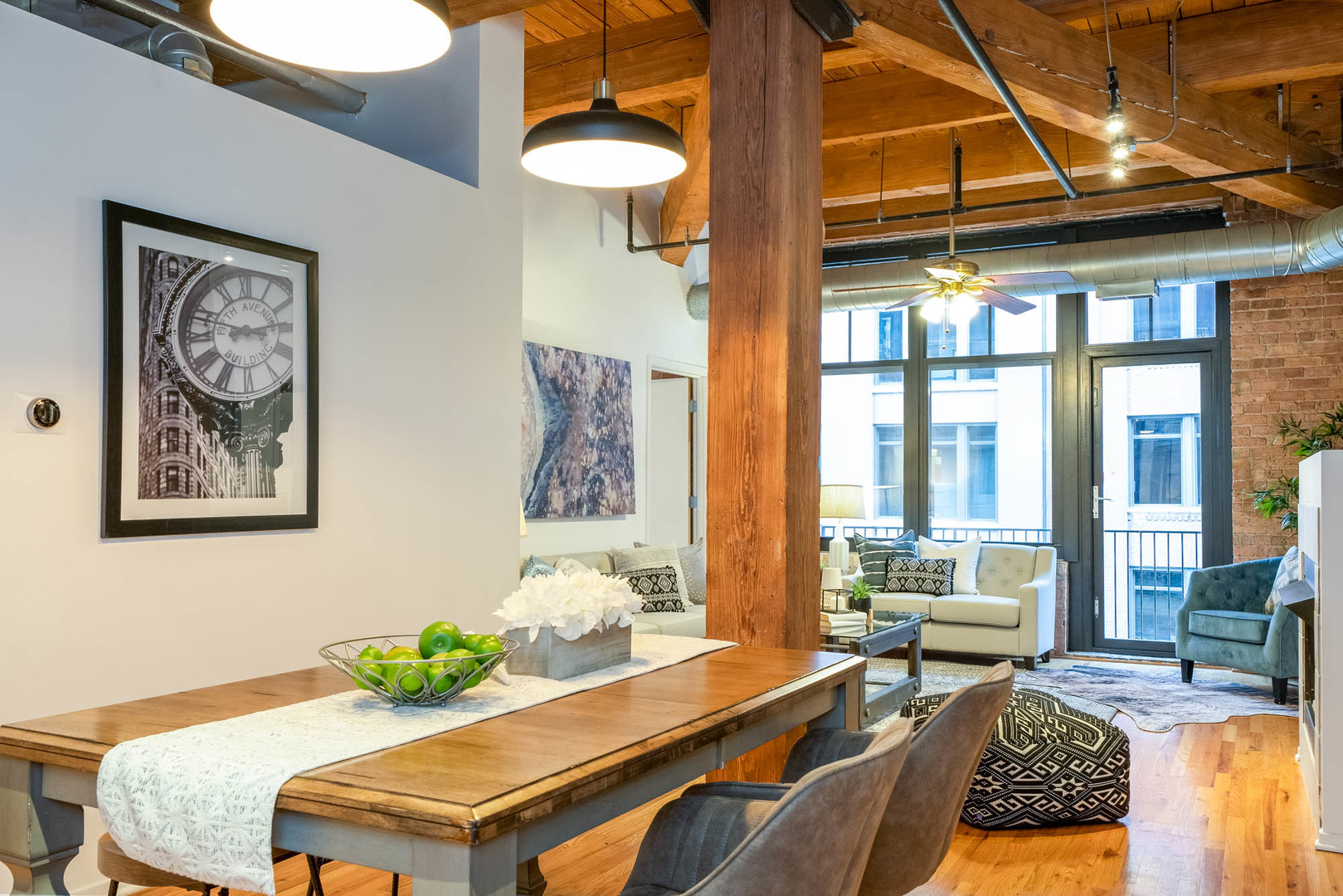 625 West Jackson Boulevard, Unit 313 Chicago, IL 60661 - Photo 4 of 33 a living room with furniture and floor to ceiling windows
