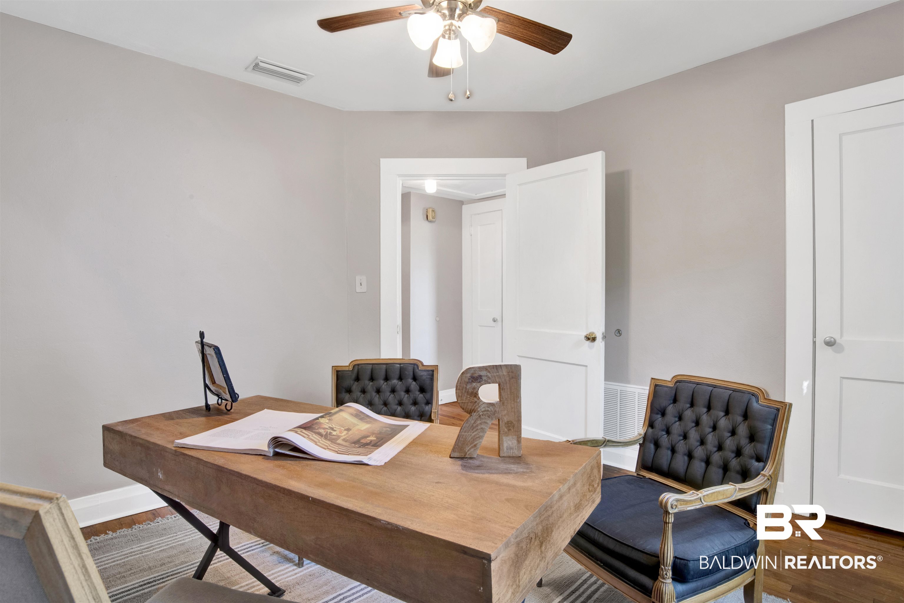 160 Emogene Place Mobile, AL 36606 - Photo 22 of 32 Bedroom / Office space featuring a ceiling fan and wood finished floors
