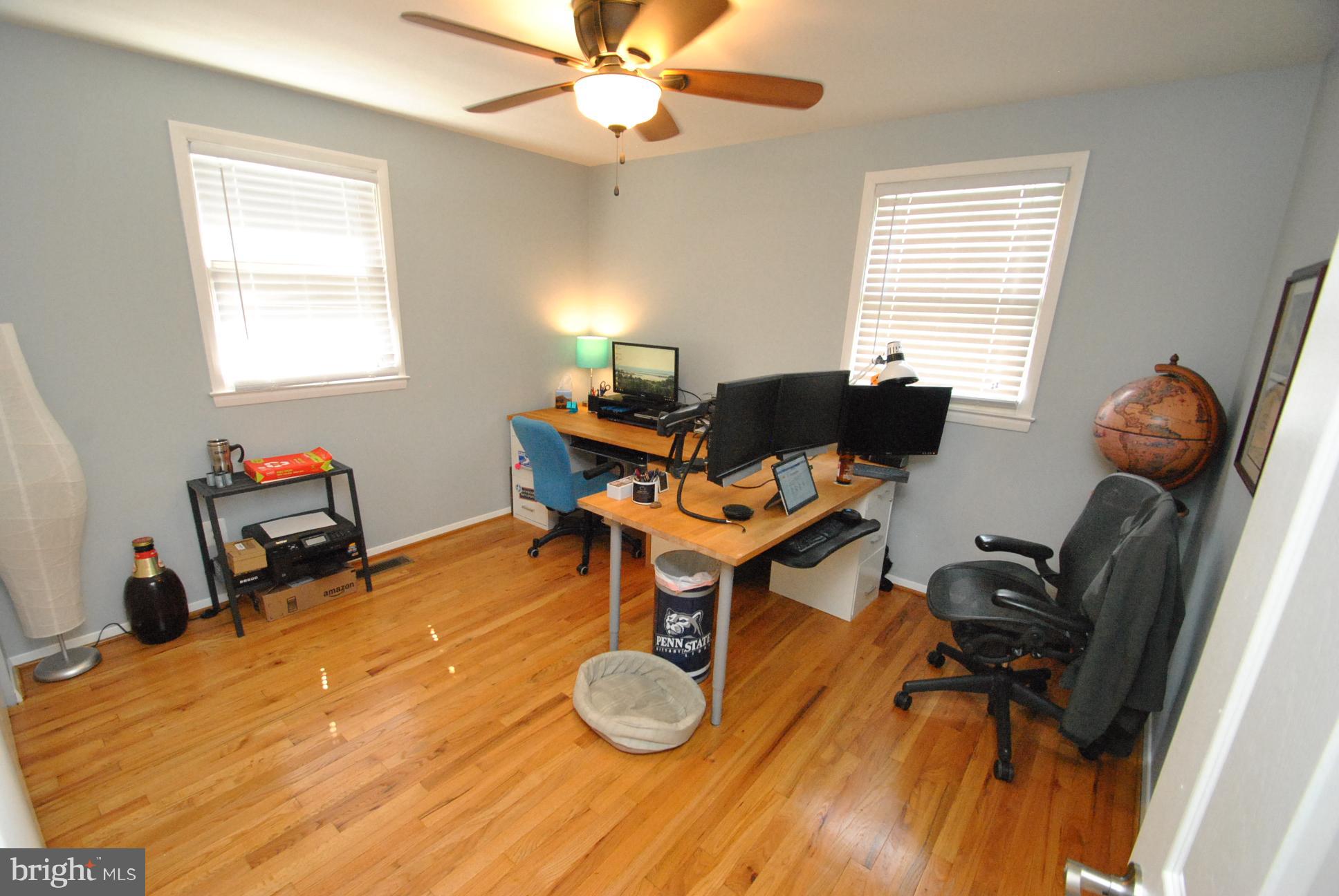 9130 Santa Rita Road Baltimore, MD 21236 - Photo 22 of 25 a work room with furniture and wooden floor