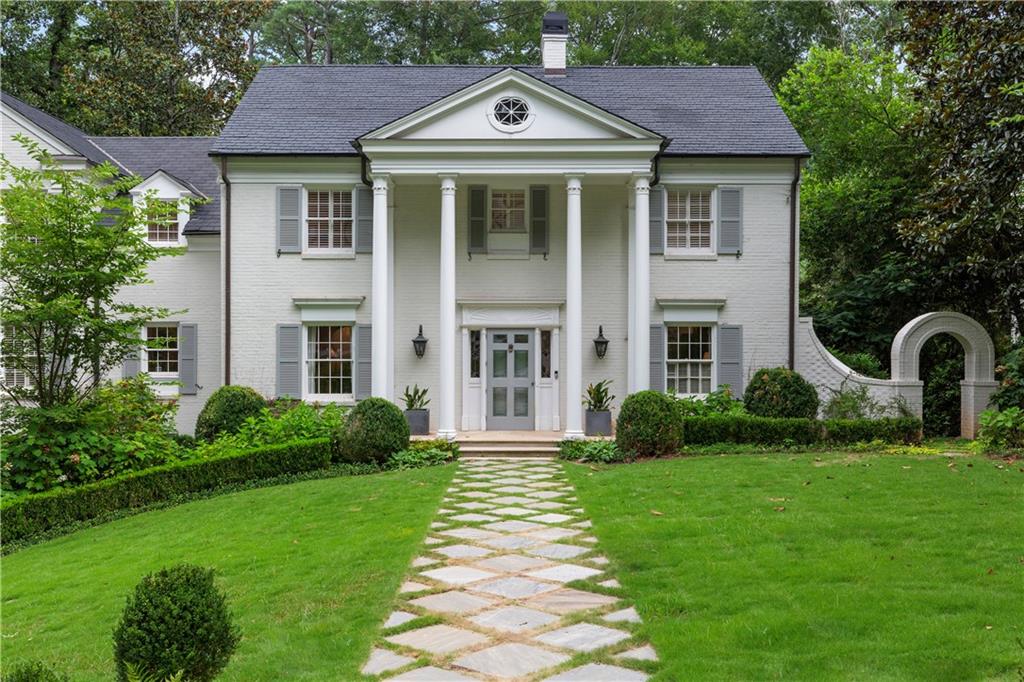 3171 Habersham Road Northwest Atlanta, GA 30305 - Photo 1 of 1 a front view of a house with garden