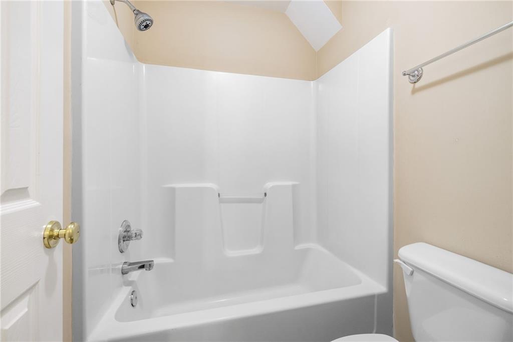 7913 Pea Ridge Road Lula, GA 30554 - Photo 25 of 51 a bathroom with a bathtub