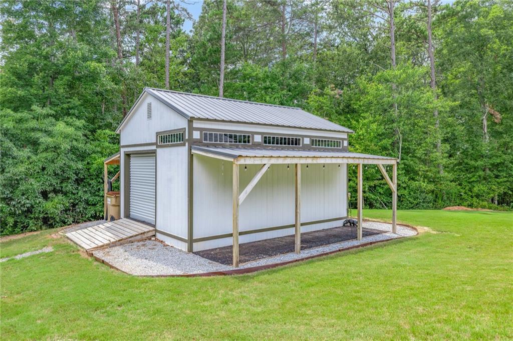 7913 Pea Ridge Road Lula, GA 30554 - Photo 3 of 51 a view of backyard with a barn