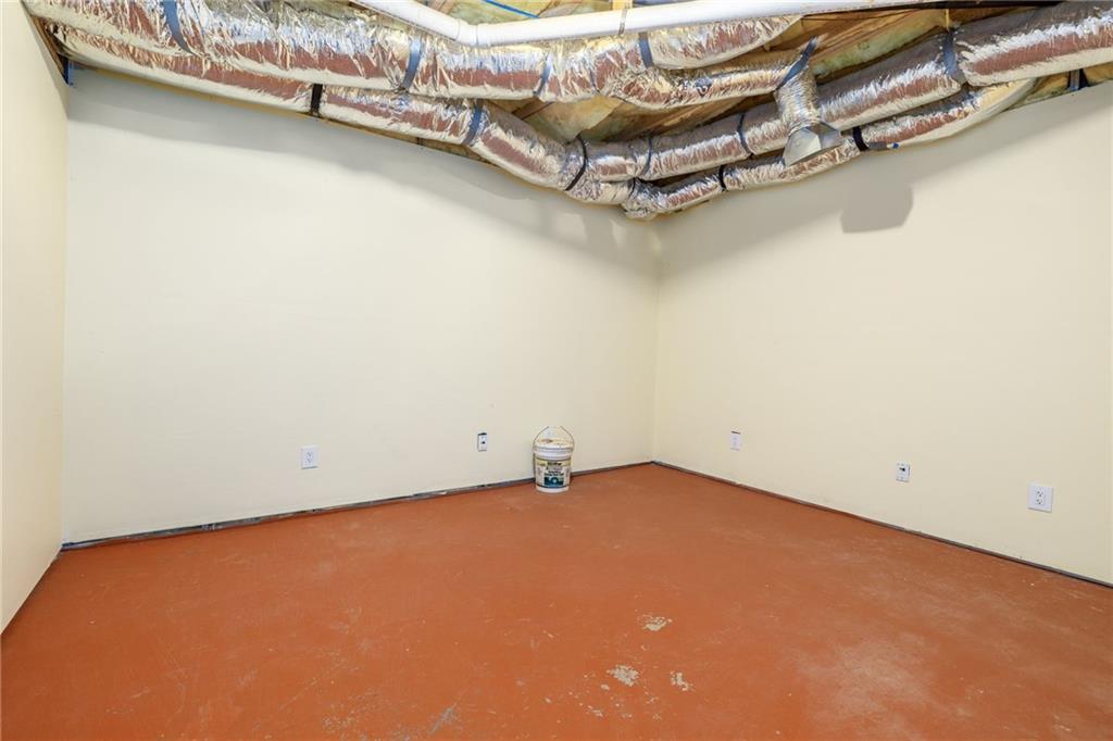 7913 Pea Ridge Road Lula, GA 30554 - Photo 39 of 51 an empty room with a wooden floor