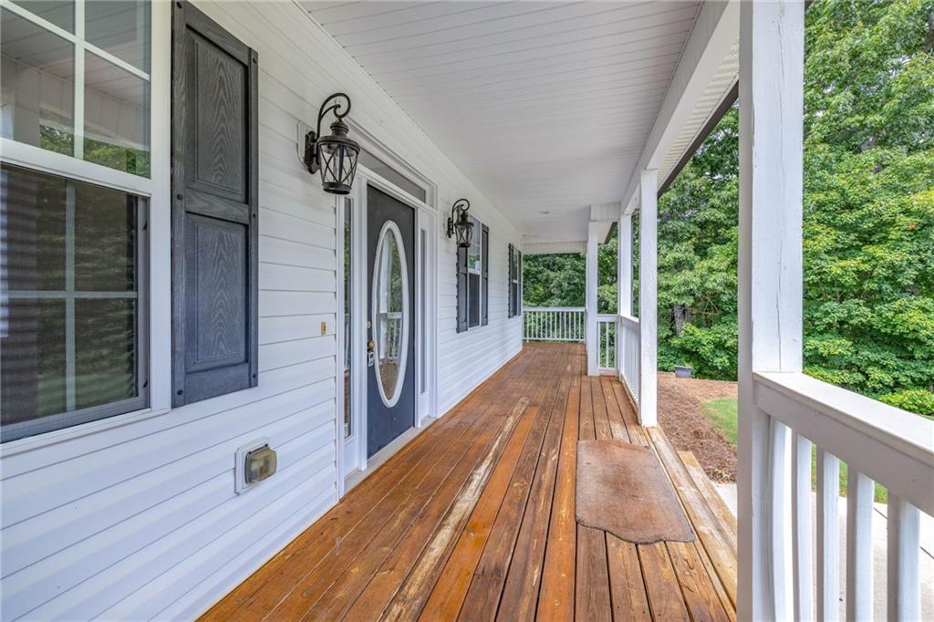 7913 Pea Ridge Road Lula, GA 30554 - Photo 5 of 51 a view of balcony and wooden floor