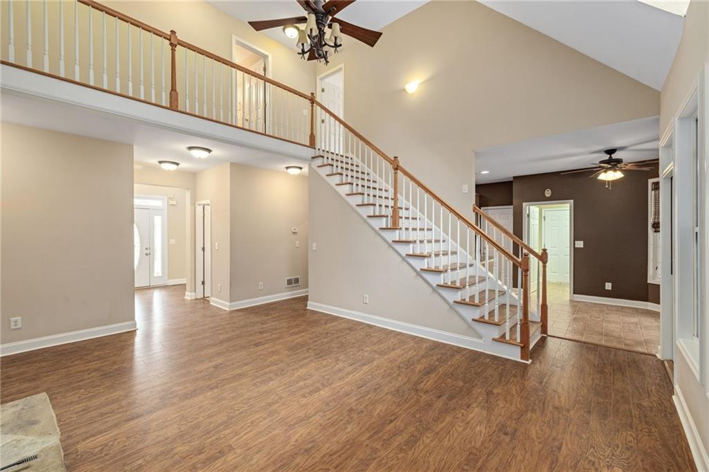 7913 Pea Ridge Road Lula, GA 30554 - Photo 7 of 51 a view of an entryway wooden floor and staircase