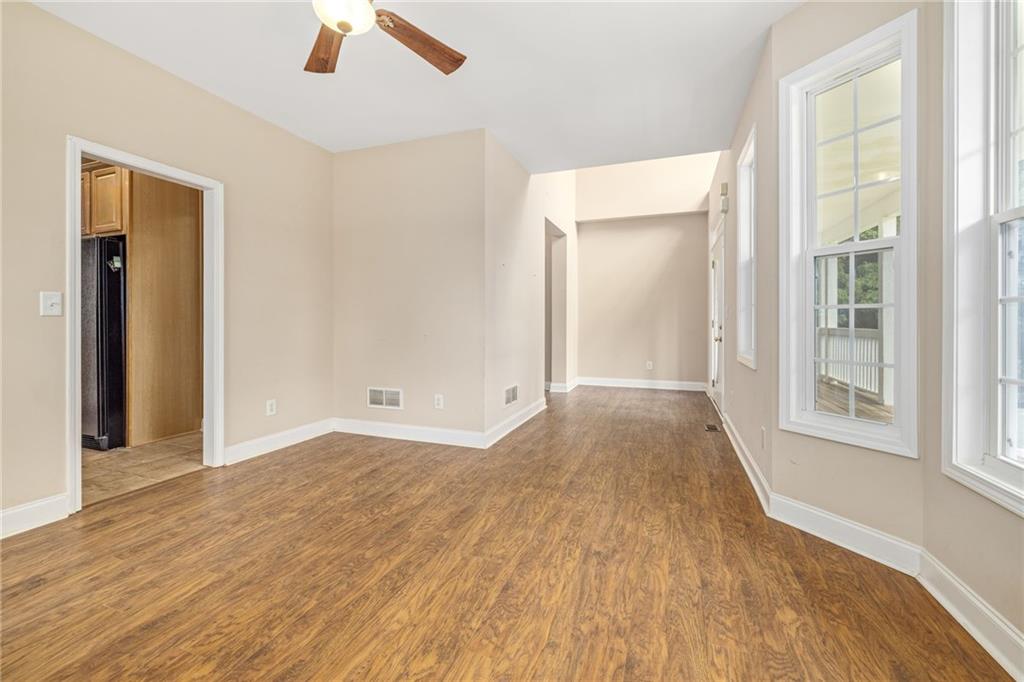 7913 Pea Ridge Road Lula, GA 30554 - Photo 9 of 51 wooden floor in an empty room with a window
