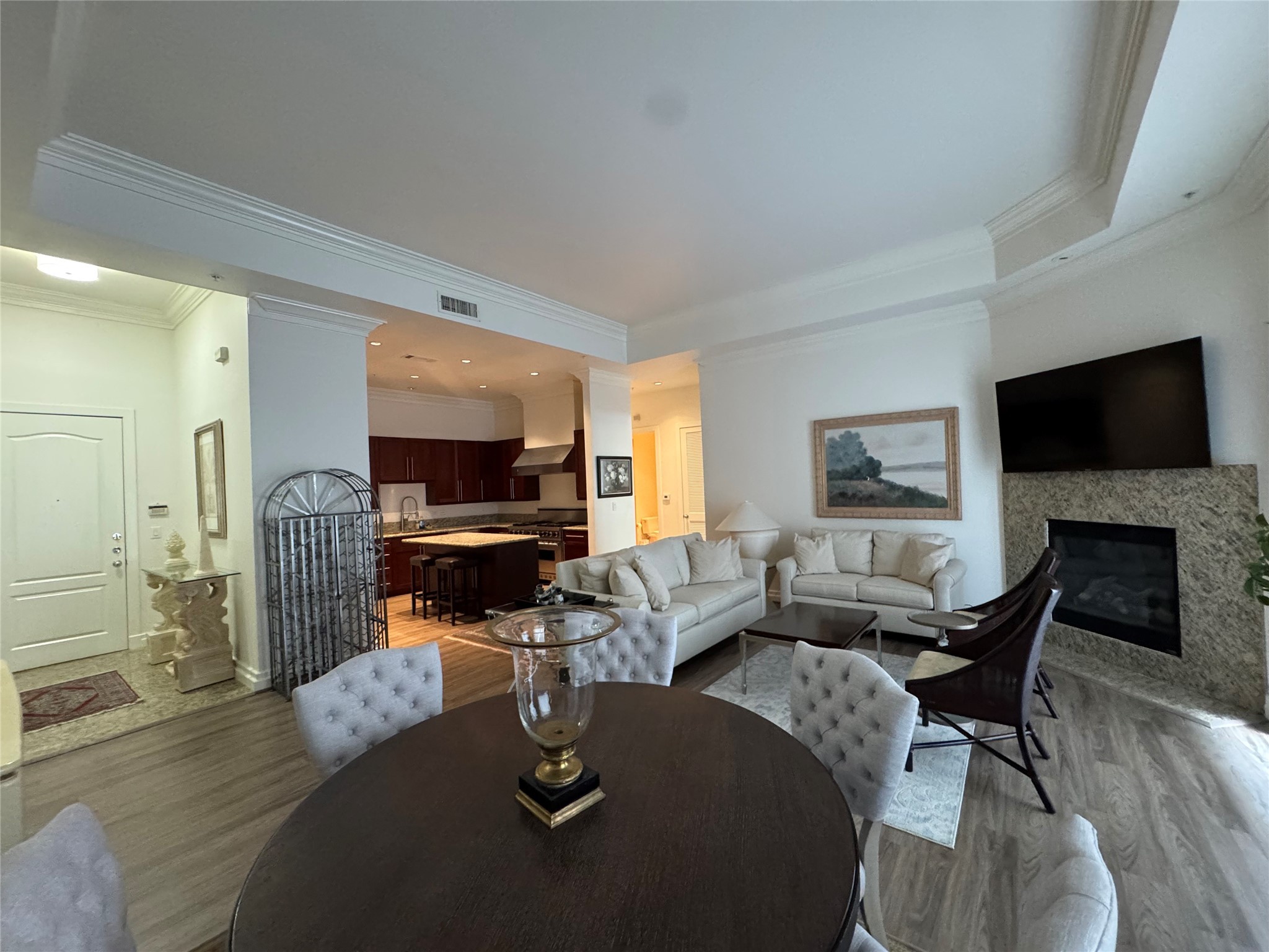 3388 Sage Road, Unit 101 Houston, TX 77056 - Photo 19 of 32 a living room with fireplace furniture and a flat screen tv