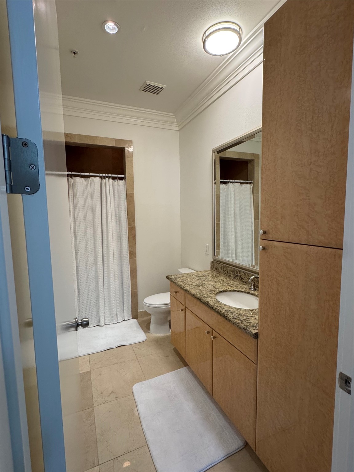 3388 Sage Road, Unit 101 Houston, TX 77056 - Photo 27 of 32 a bathroom with a granite countertop sink and a mirror