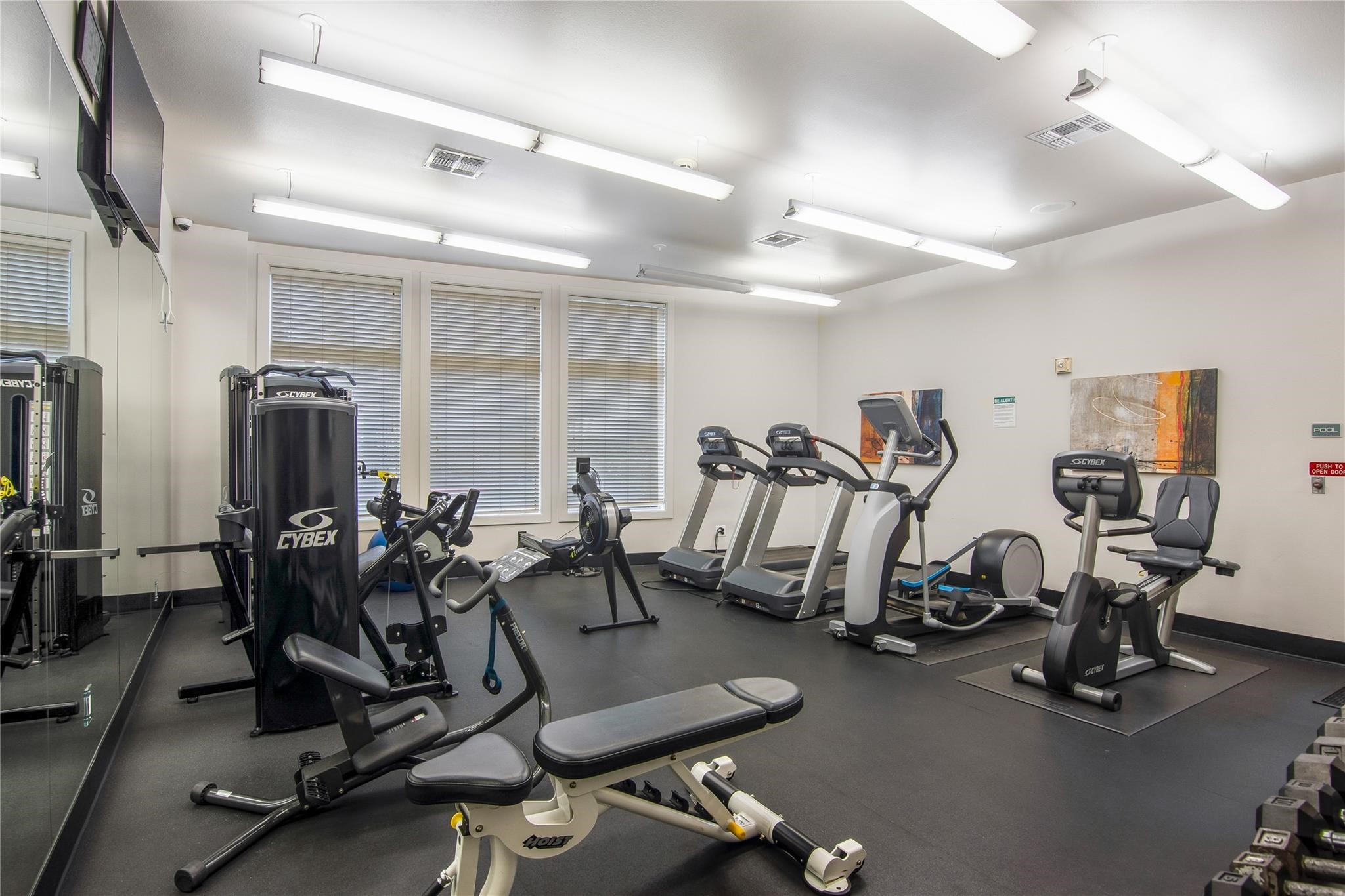 3388 Sage Road, Unit 101 Houston, TX 77056 - Photo 4 of 32 a view of a room with gym equipment