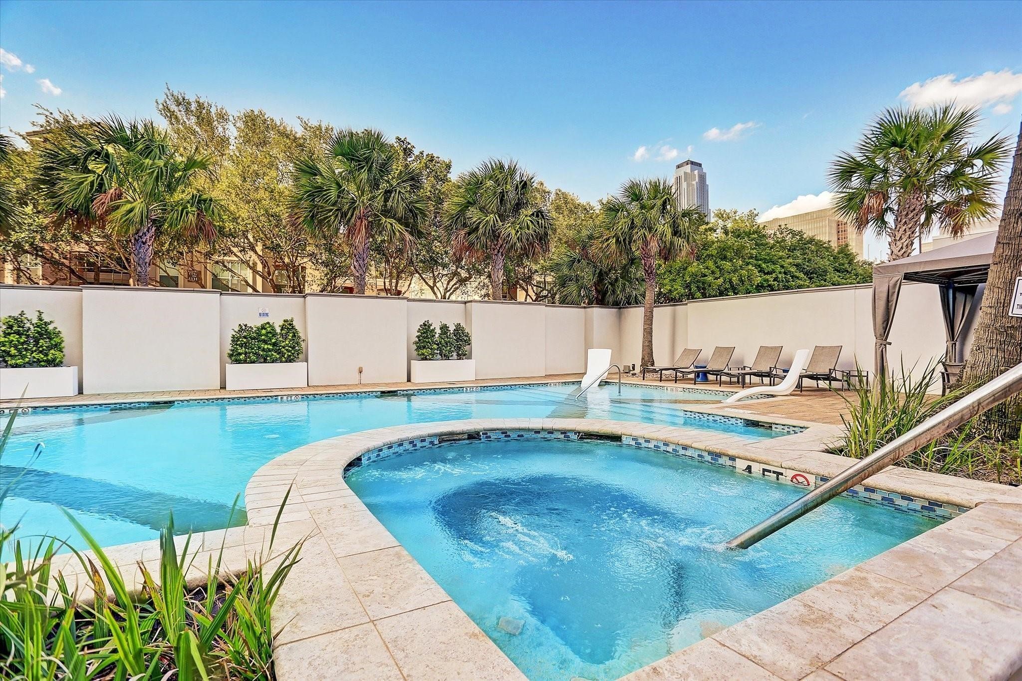 3388 Sage Road, Unit 101 Houston, TX 77056 - Photo 8 of 32 a view of a swimming pool with a patio and a garden