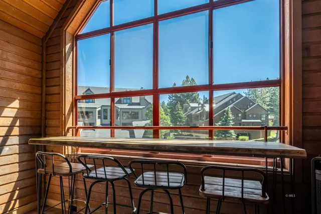 a view of a city from a balcony with furniture
