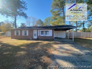2196 Delta Drive Fayetteville, NC 28304 - Photo 1 of 12 a view of a house with a yard and a garage