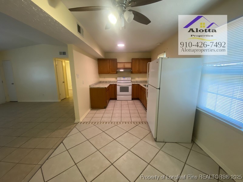 2196 Delta Drive Fayetteville, NC 28304 - Photo 4 of 12 a kitchen with stainless steel appliances a refrigerator and microwave