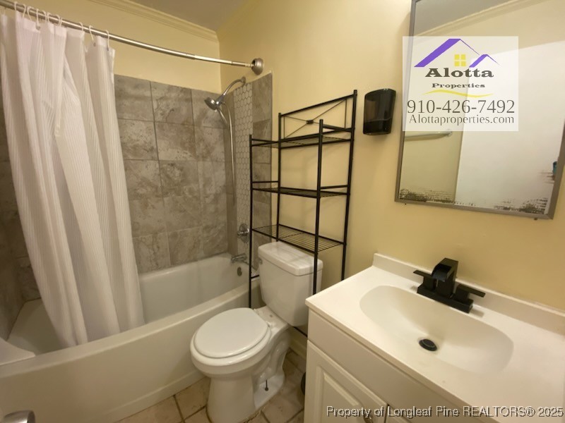 2196 Delta Drive Fayetteville, NC 28304 - Photo 8 of 12 a bathroom with a sink toilet and shower