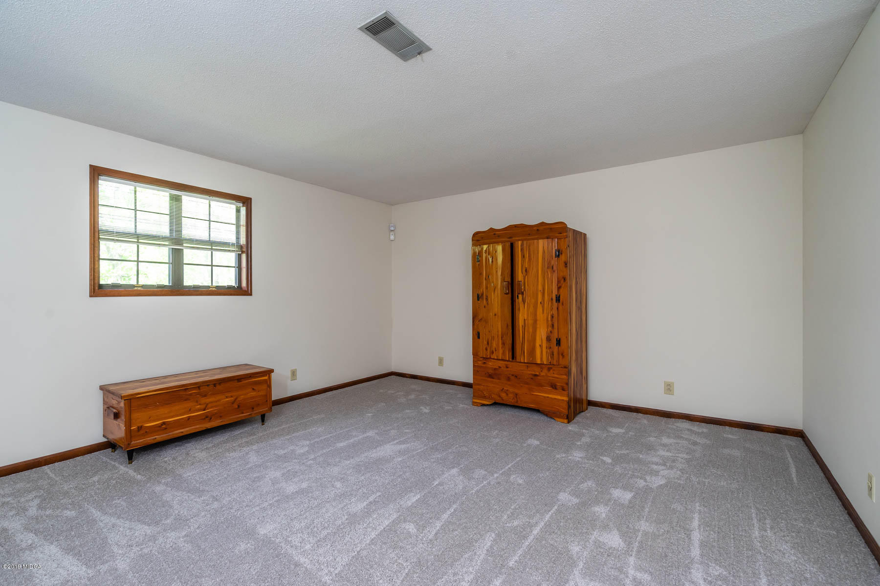 6579 New Forsyth Road Macon, GA 31210 - Photo 22 of 27 an empty room with windows