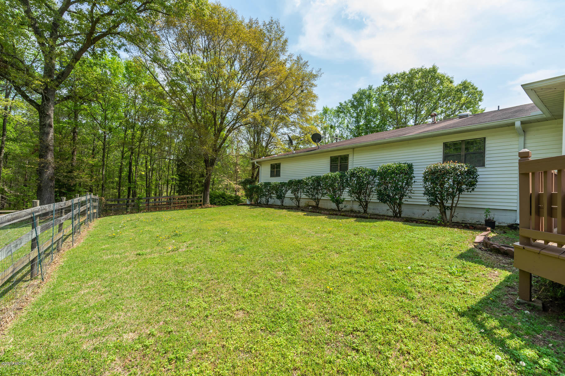 6579 New Forsyth Road Macon, GA 31210 - Photo 6 of 27 a view of a backyard with a patio