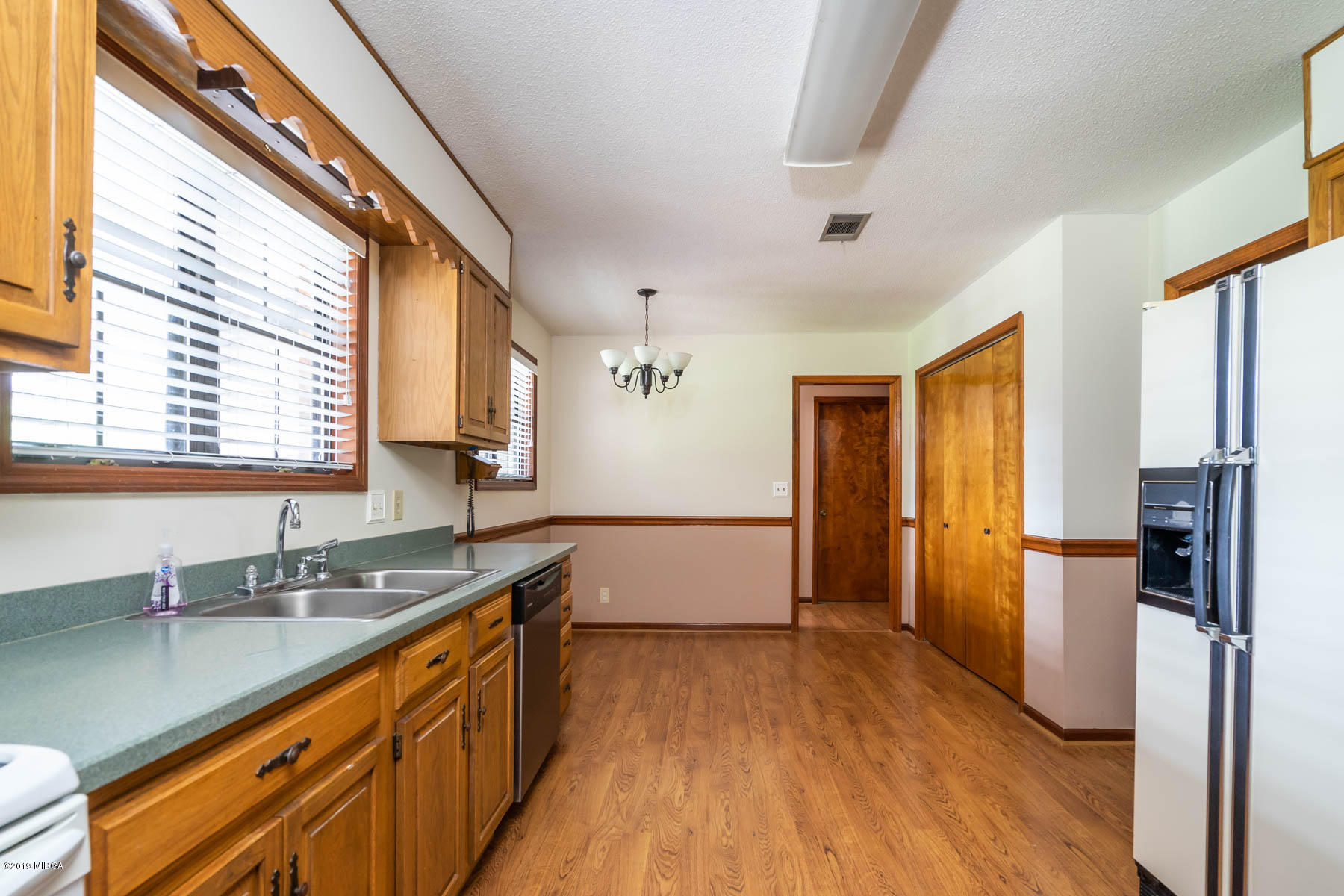 6579 New Forsyth Road Macon, GA 31210 - Photo 10 of 27 a view of a kitchen with a sink and wooden floor