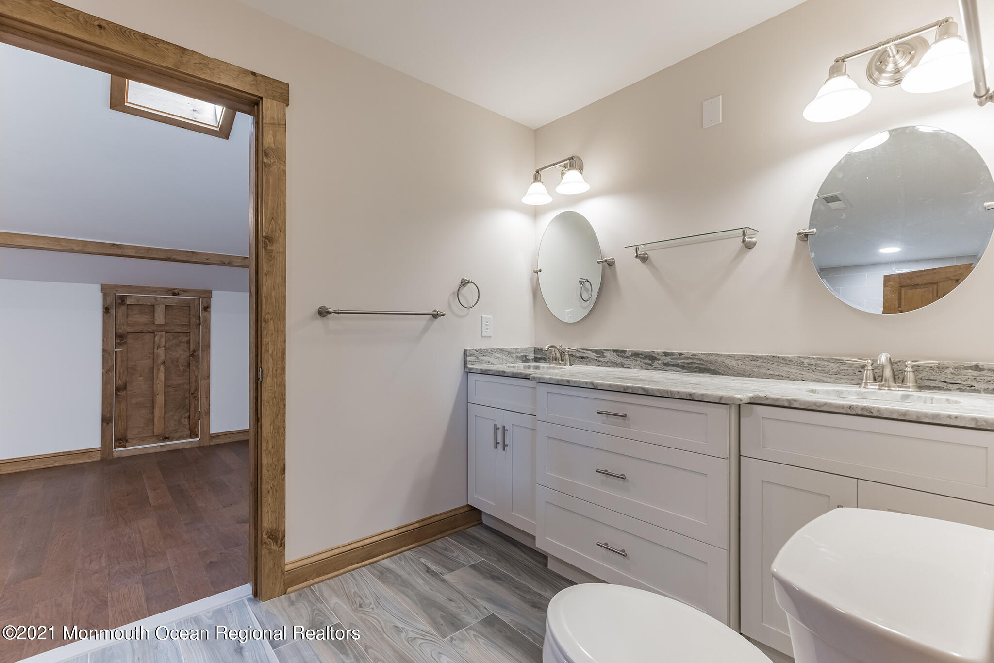 97 Edgewater Drive Tuckerton, NJ 08087 - Photo 23 of 41 a bathroom with a toilet a sink and mirror
