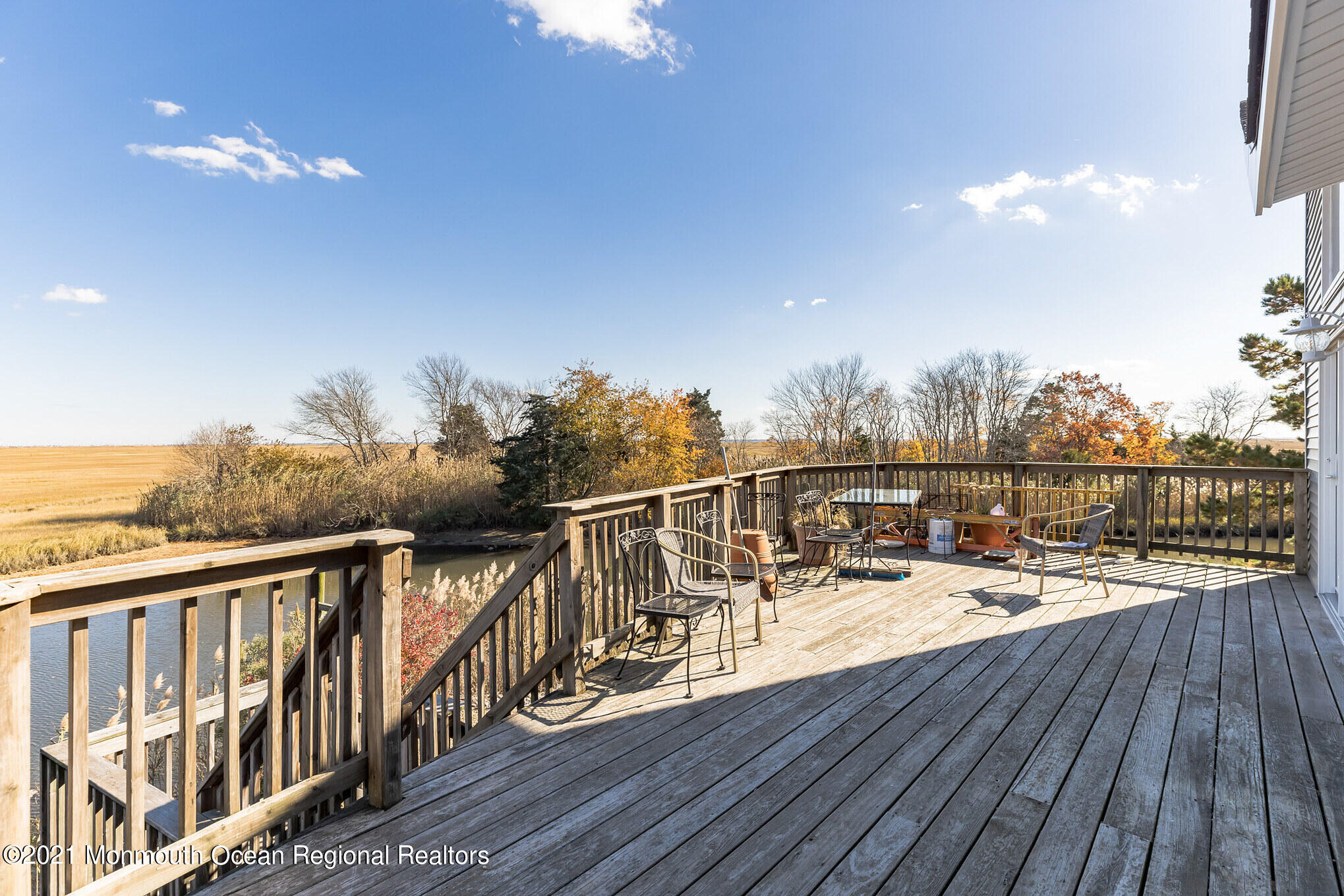 97 Edgewater Drive Tuckerton, NJ 08087 - Photo 26 of 41 a view of a balcony with wooden floor and iron stairs