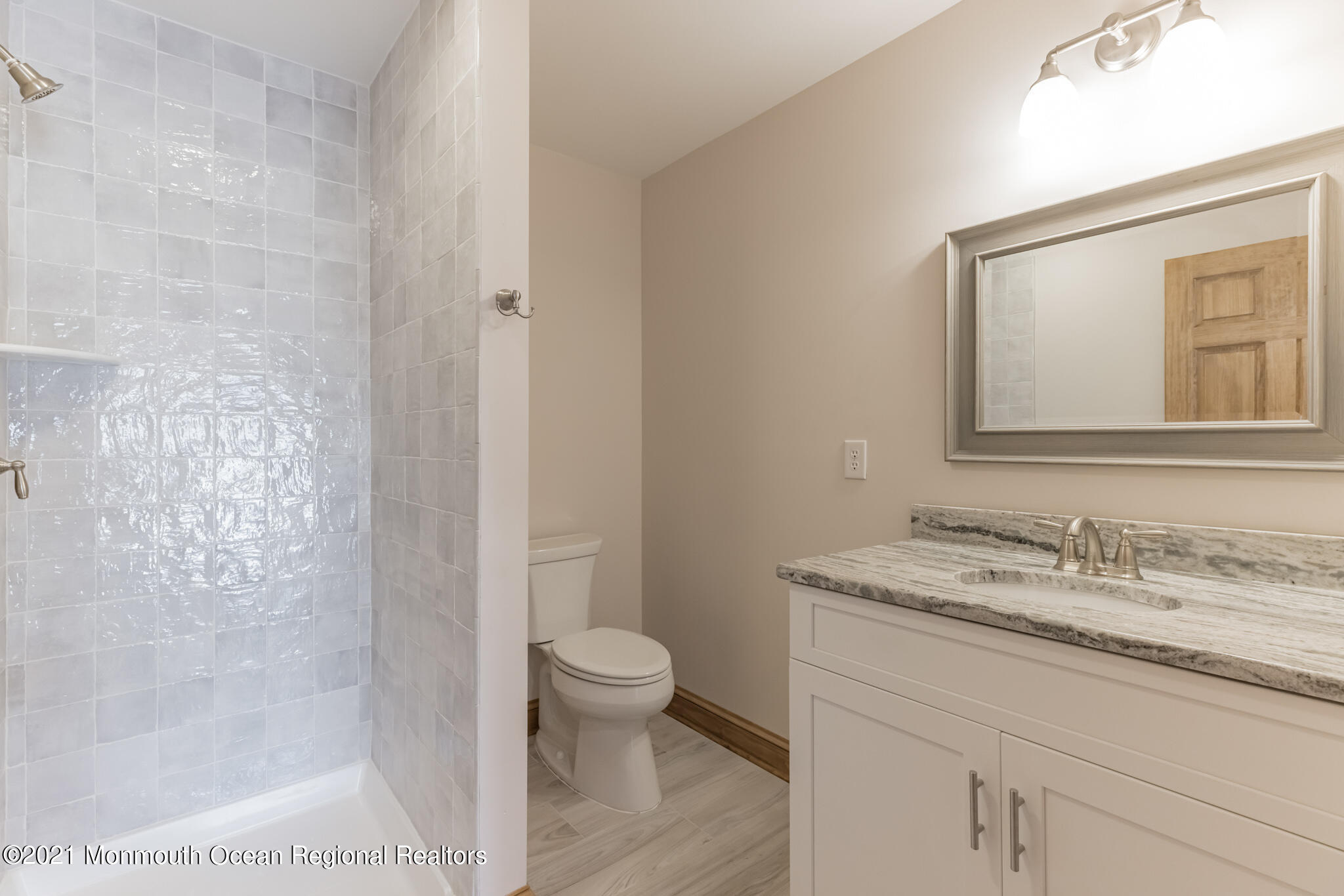 97 Edgewater Drive Tuckerton, NJ 08087 - Photo 28 of 41 a bathroom with a granite countertop sink a toilet and a mirror